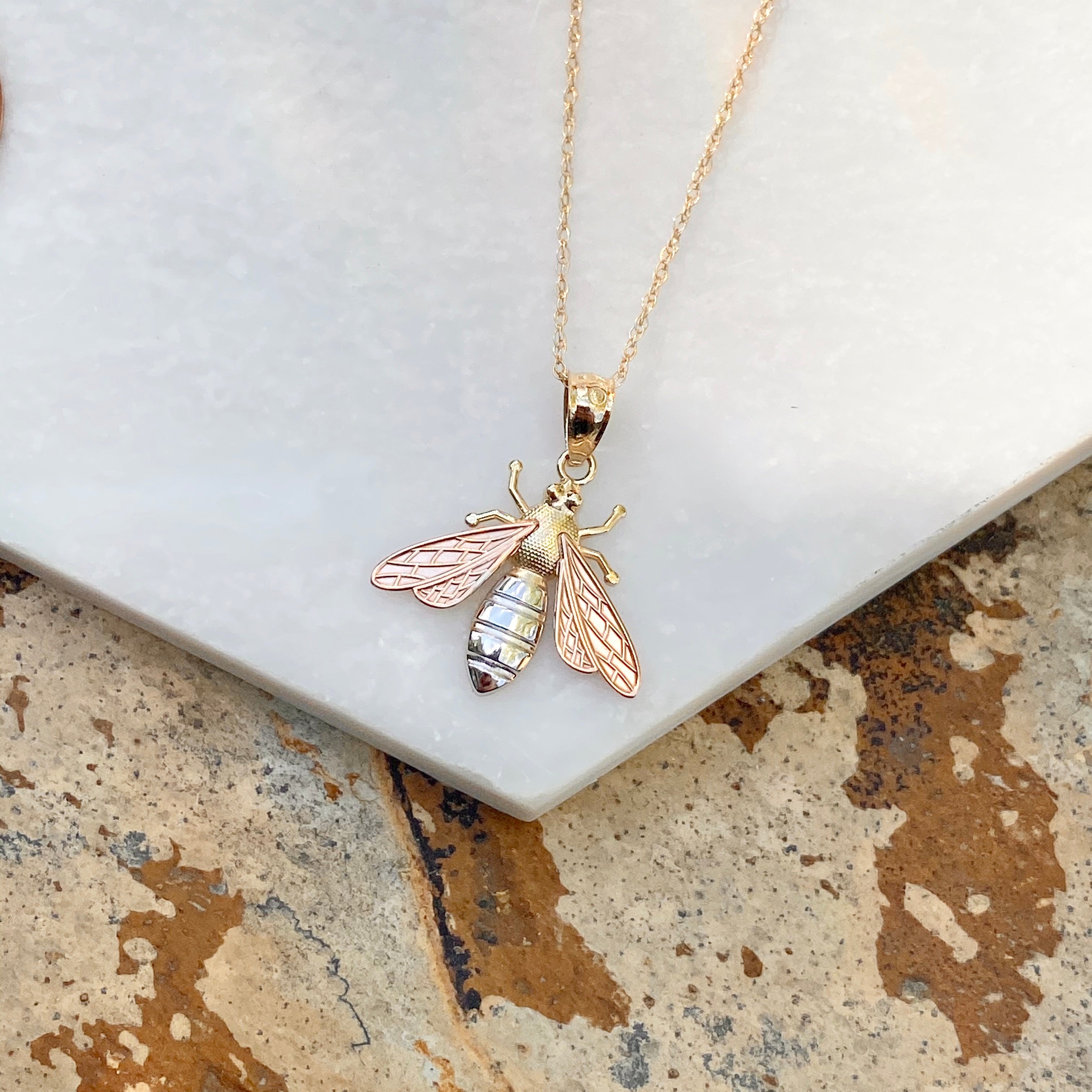 Tri gold pendant online