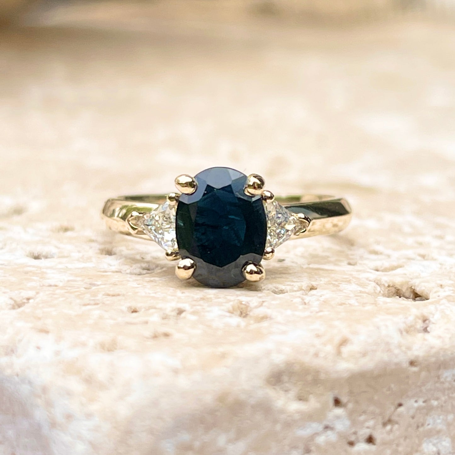 14KT Yellow Gold Oval .95 CT Blue Sapphire + Trillion Diamond Accent Ring