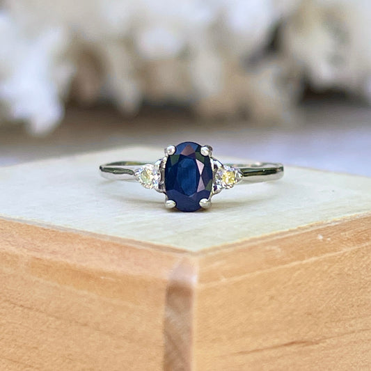 Platinum Oval .75 CT Blue Sapphire + Round Diamond Accent Ring