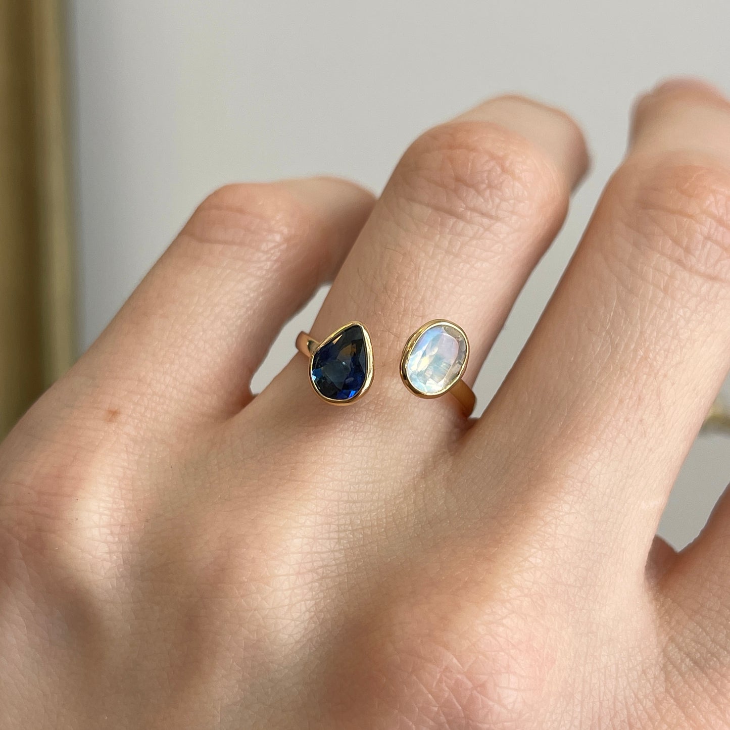 18KT Yellow Gold Pear Blue Sapphire + Oval Moonstone Open Ring