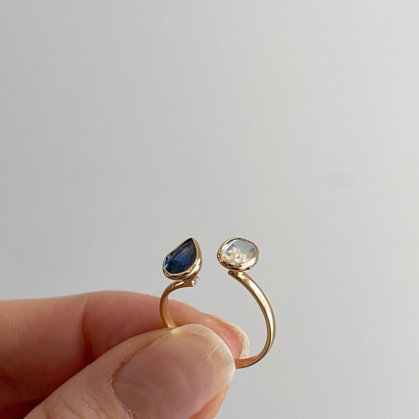 18KT Yellow Gold Pear Blue Sapphire + Oval Moonstone Open Ring